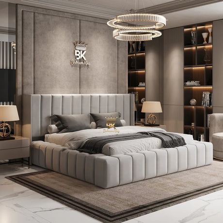 Modern bedroom with a gray upholstered bed, nightstands, and decorative elements.