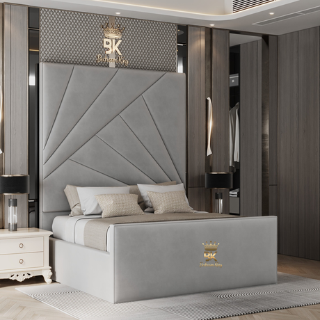 Grey upholstered bed with geometric headboard in a modern bedroom setting.