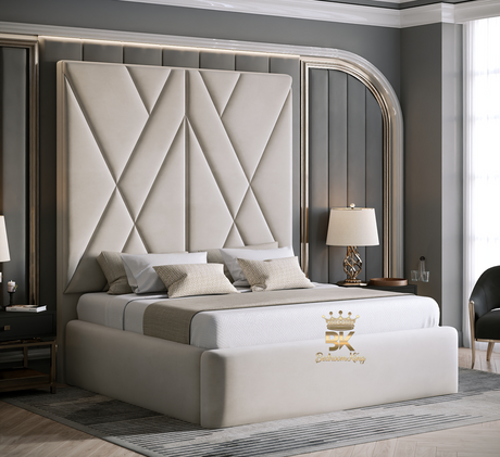 Luxury cream bedroom with a large upholstered bed and geometric headboard. 