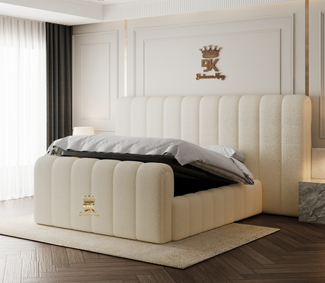 Beige upholstered bed with tufted design in a room with white walls and a crown logo.
