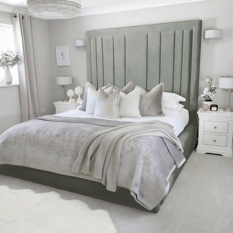 Neatly made bed frame with silver plush velvet 