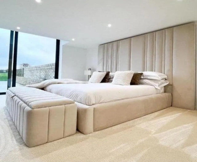 Bed frame with high headboard and padded sides in cream plush velvet