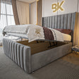Grey plush upholstered bed with ottoman divan storage 