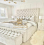 Tall luxury bed frame with high base in cream plush velvet 