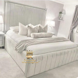 Bed frame with tall headboard and high base in silver plush velvet